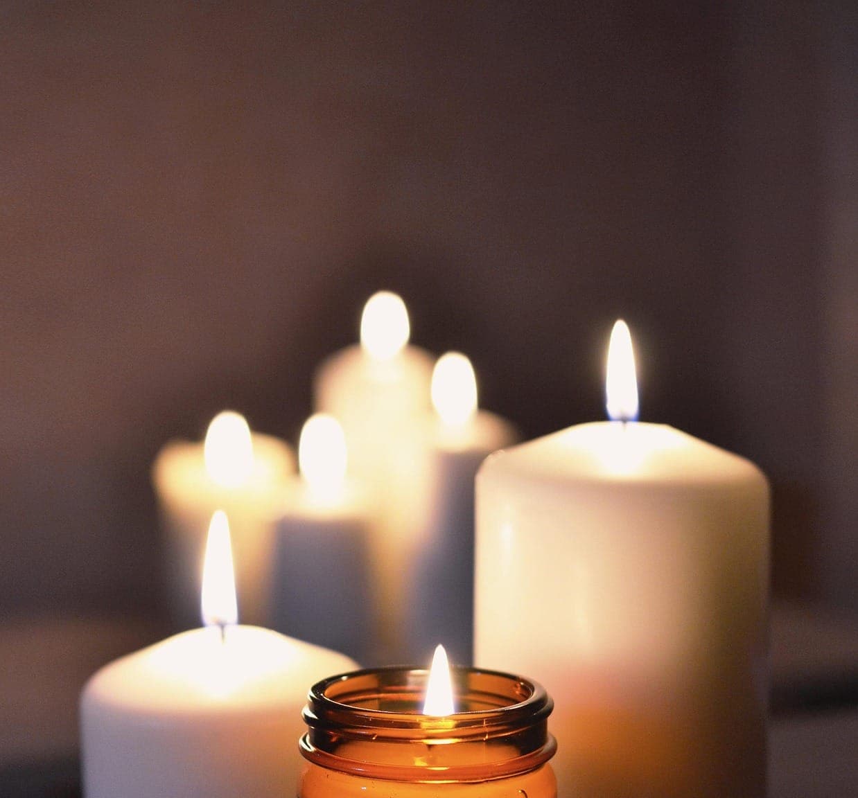 Candles glowing in the half-light